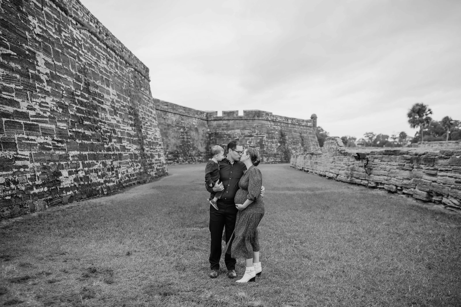 A family at the coquina walls of the Castillo de San Marcos in St. Augustine