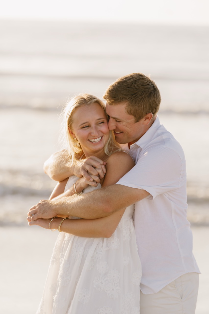 Couple walking hand in hand Florida engagement