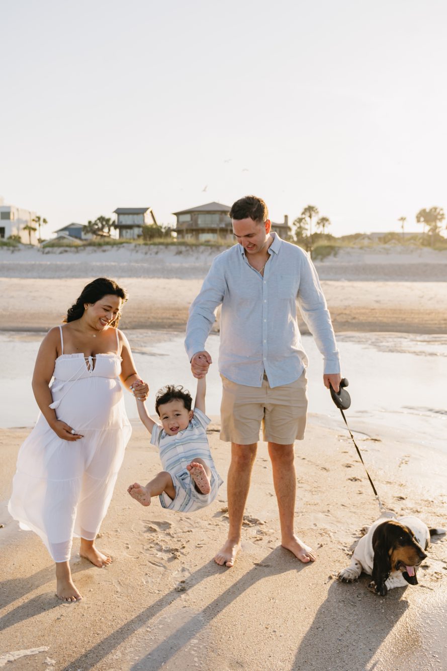 Family maternity session with toddler and basset hound at golden hour, 18th Street Beach Access in Atlantic Beach FL by Lee Photo + Video