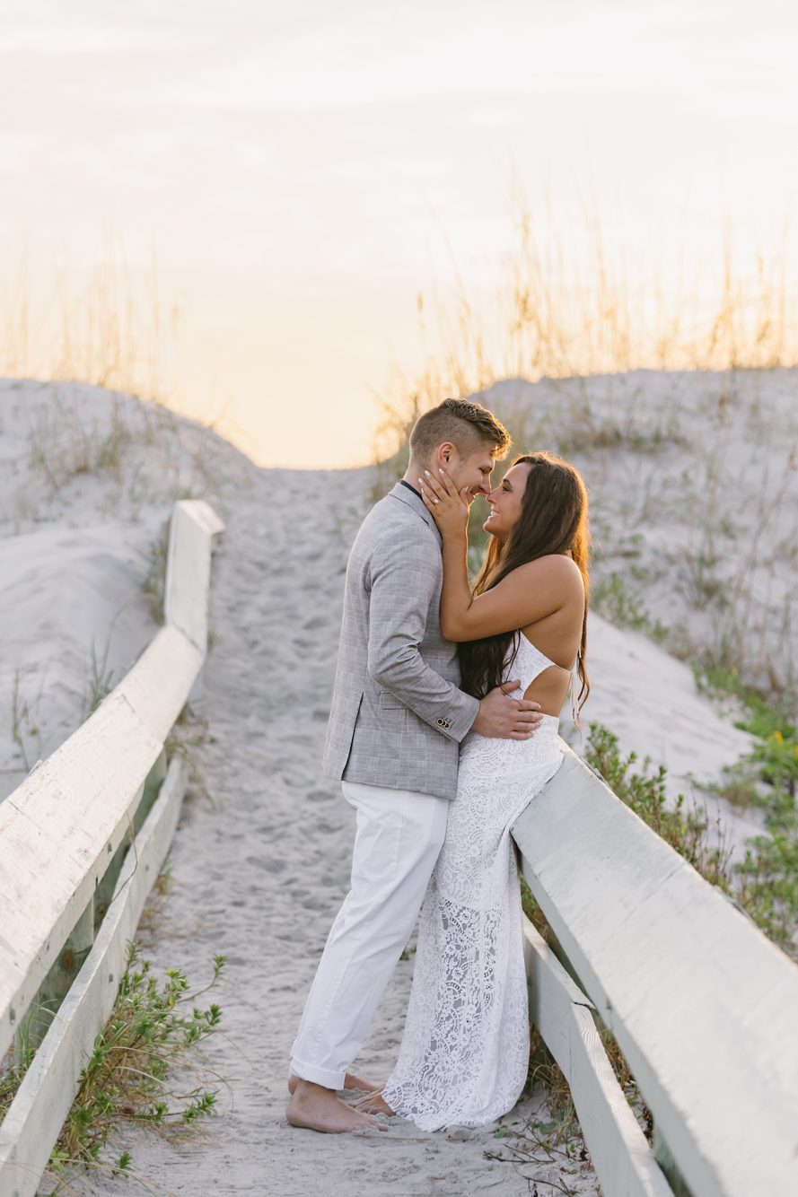 Maternity portrait kneeling in the surf at 18th Street Beach Access, Atlantic Beach Florida by Lee Photo + Video