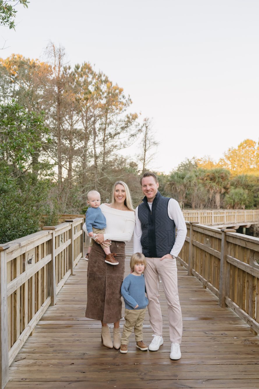 Family of four on the wooden boardwalk at Bird Island Park, Ponte Vedra Beach Florida