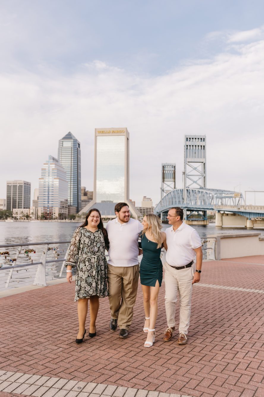 Family photo session in front of the Friendship Fountain water show at golden hour, Jacksonville FL by Lee Photo + Video