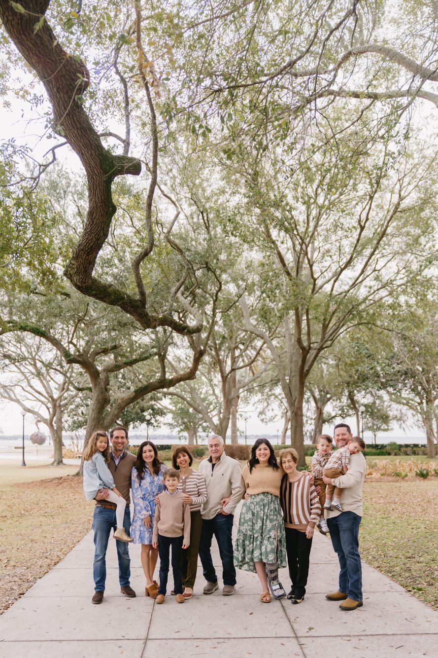 Three generations gathered beneath the sprawling oaks at Memorial Park in Riverside by Lee Photo + Video