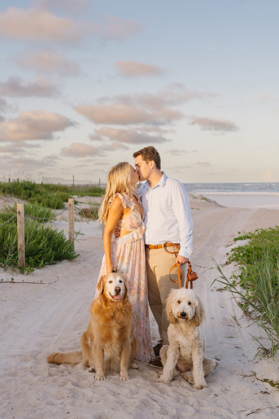 Family with baby girl sitting on the jetty rocks at golden hour, Vilano Beach Florida
