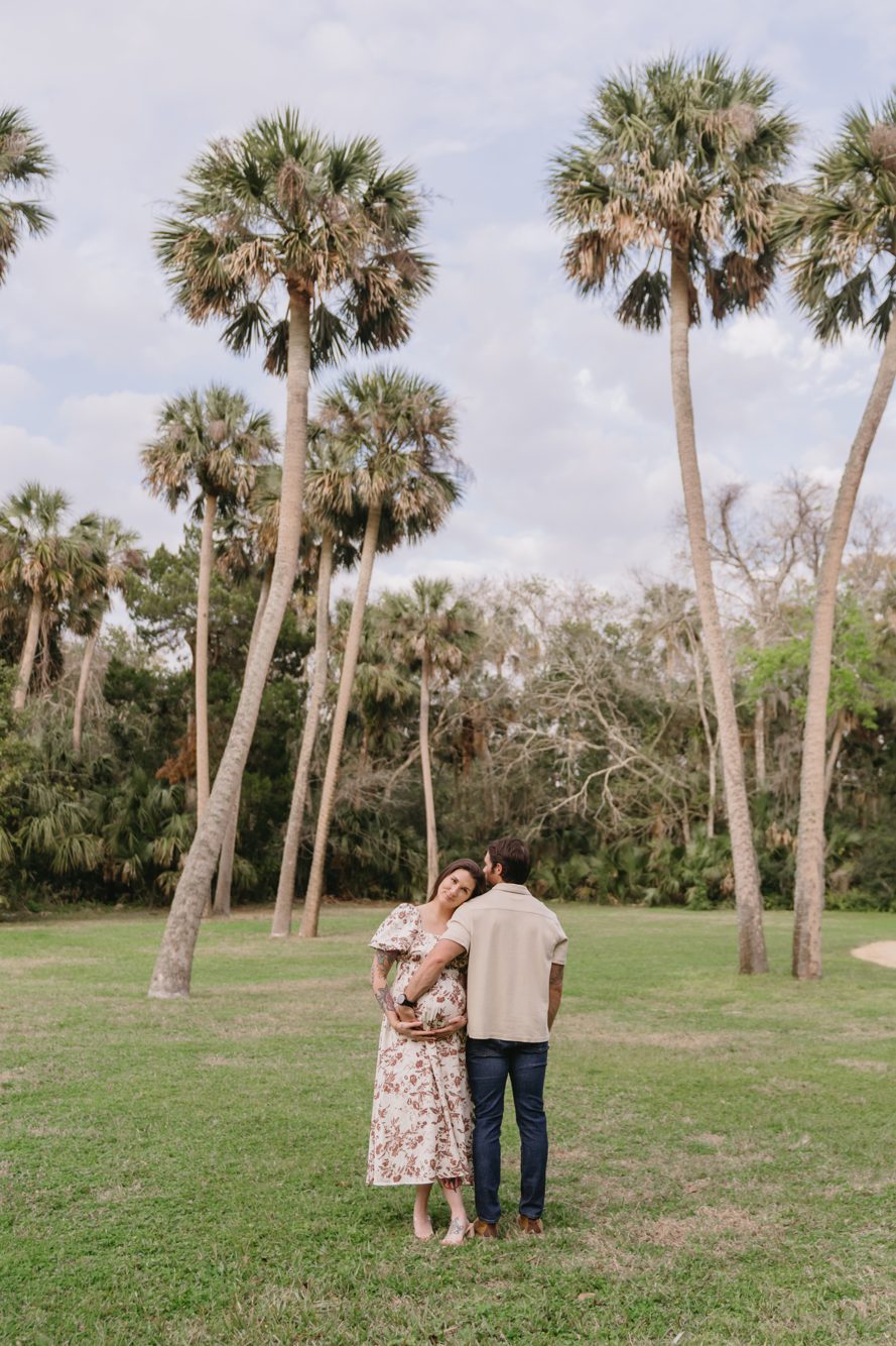 Couple under the oak canopy at Washington Oaks Gardens by Lee Photo + Video