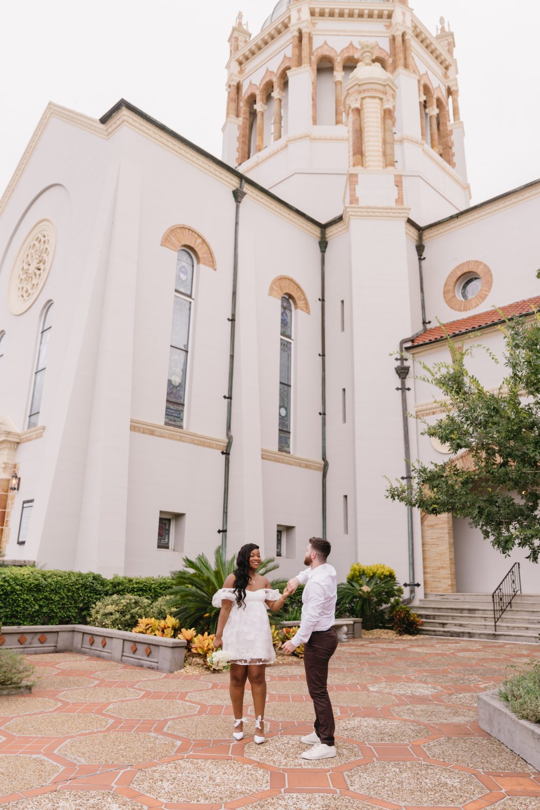 A couple in the courtyard of Memorial Presbyterian Church in St. Augustine