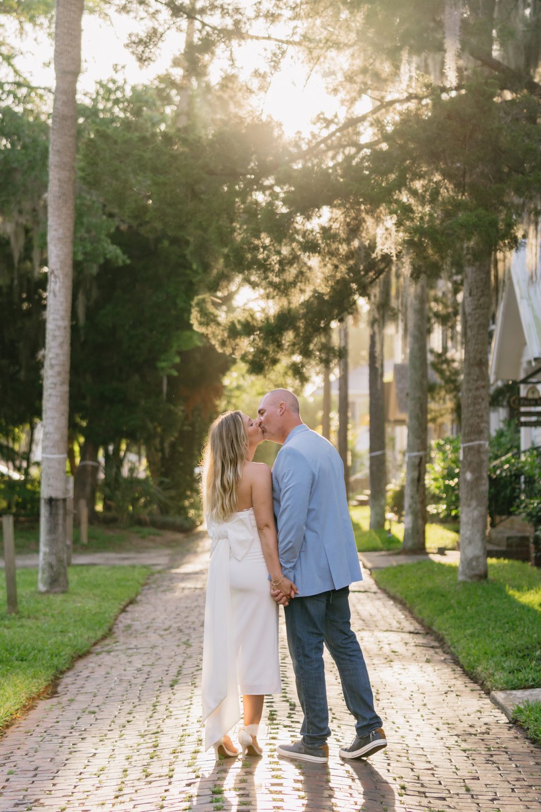 A couple on the palm-lined brick lane of Palm Row in St. Augustine