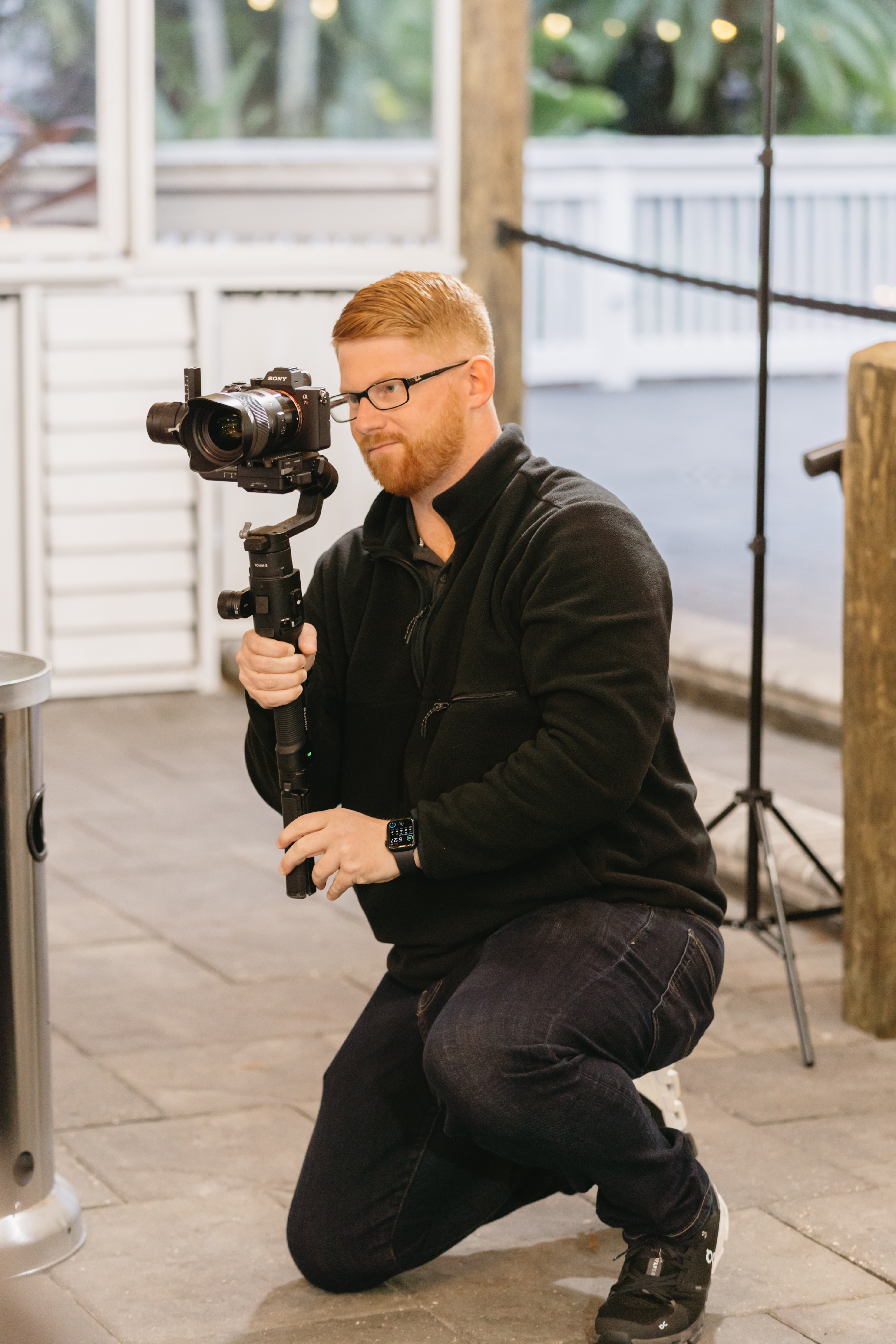 Taylor holding gimbal camera at a Florida wedding